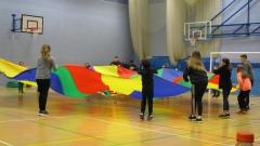 Children playing with a parachute