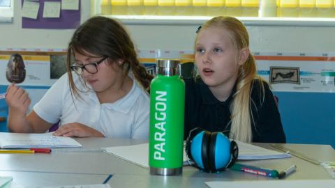 Two girls in a classroom setting