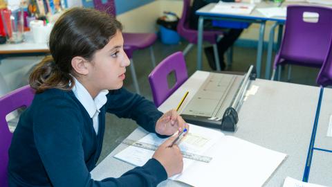 And attentive pupil listens to her teacher